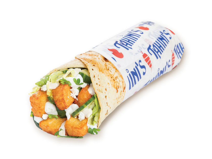 Halloumi wrap rolled in saj bread with tzatziki, feta, pita chips, tahini, parsley, tomatoes and lettuce